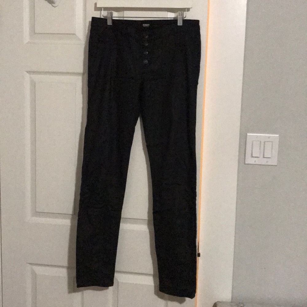 Button fly coated black skinny jeans